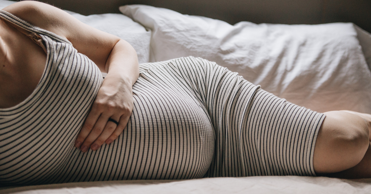 A heavily pregnant woman who is dealing with anxiety during pregnancy