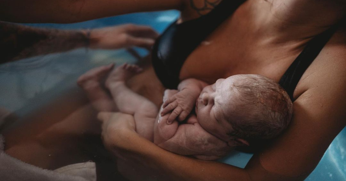 A woman and her newborn doing skin-to-skin.
