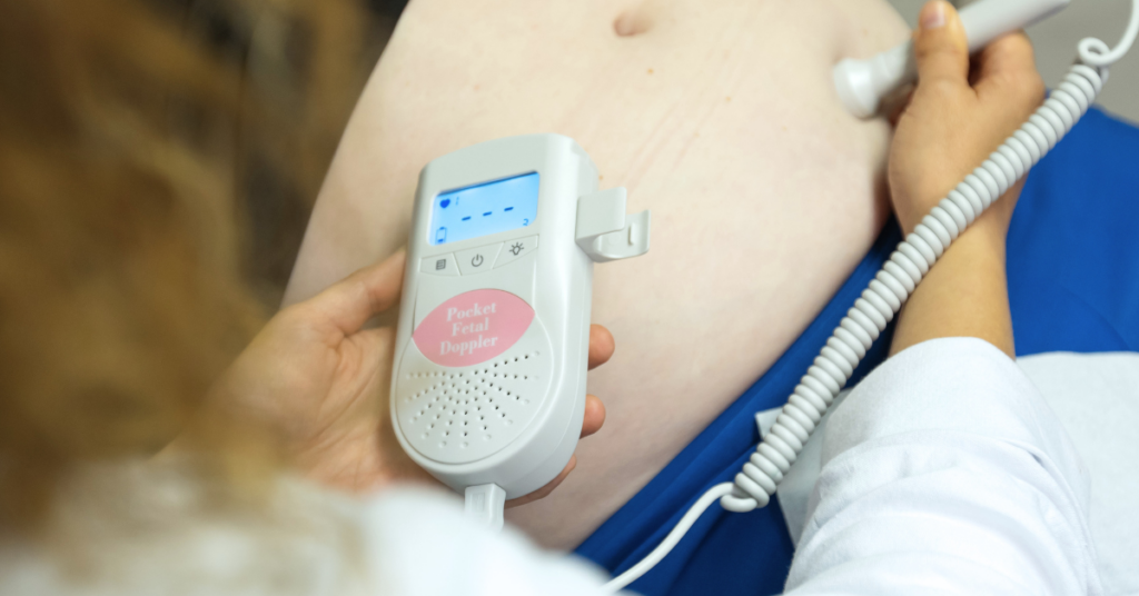 prenatal testing ultrasound on woman's belly