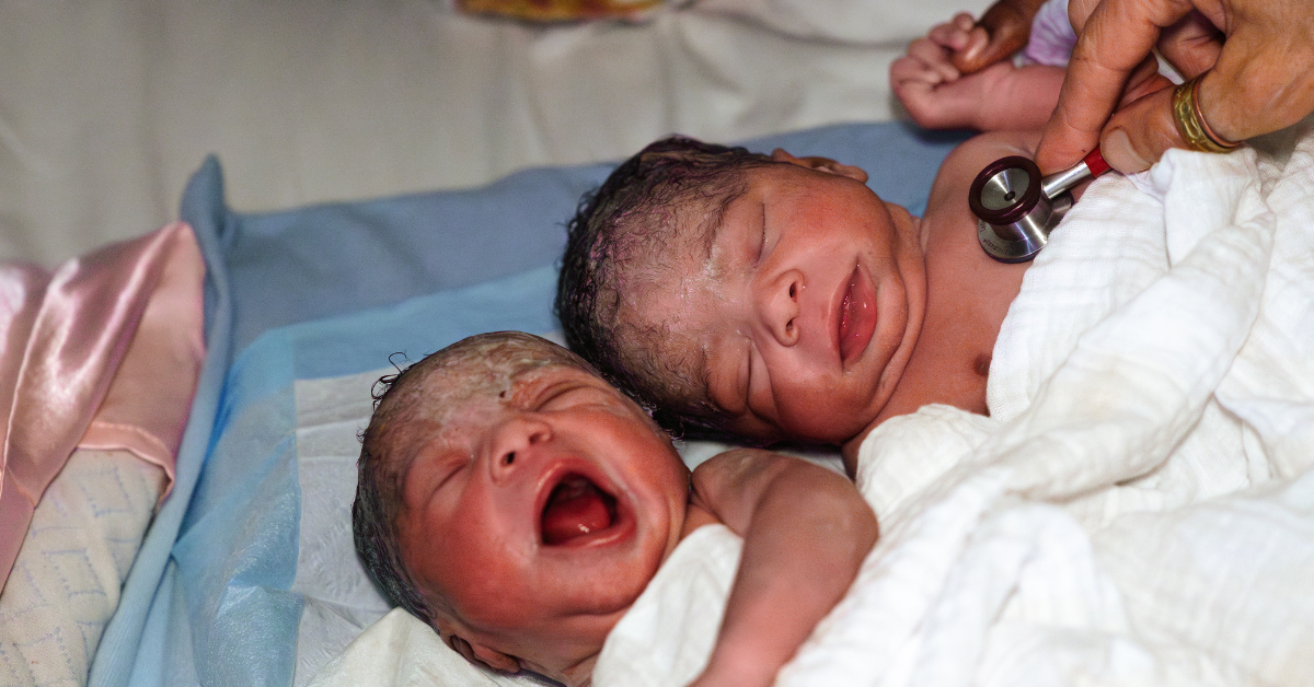 Im Pregnant With Twins What is the Best Way to Plan a Home Birth - Midwife360 Fadwah Halaby Certified Nurse Midwife Twin newborns on hospital bed; one crying, one calm, while a clinician checks the heartbeat with a stethoscope.